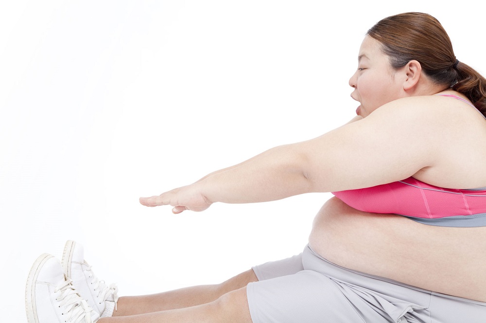 39851381 - overweight women to stretch